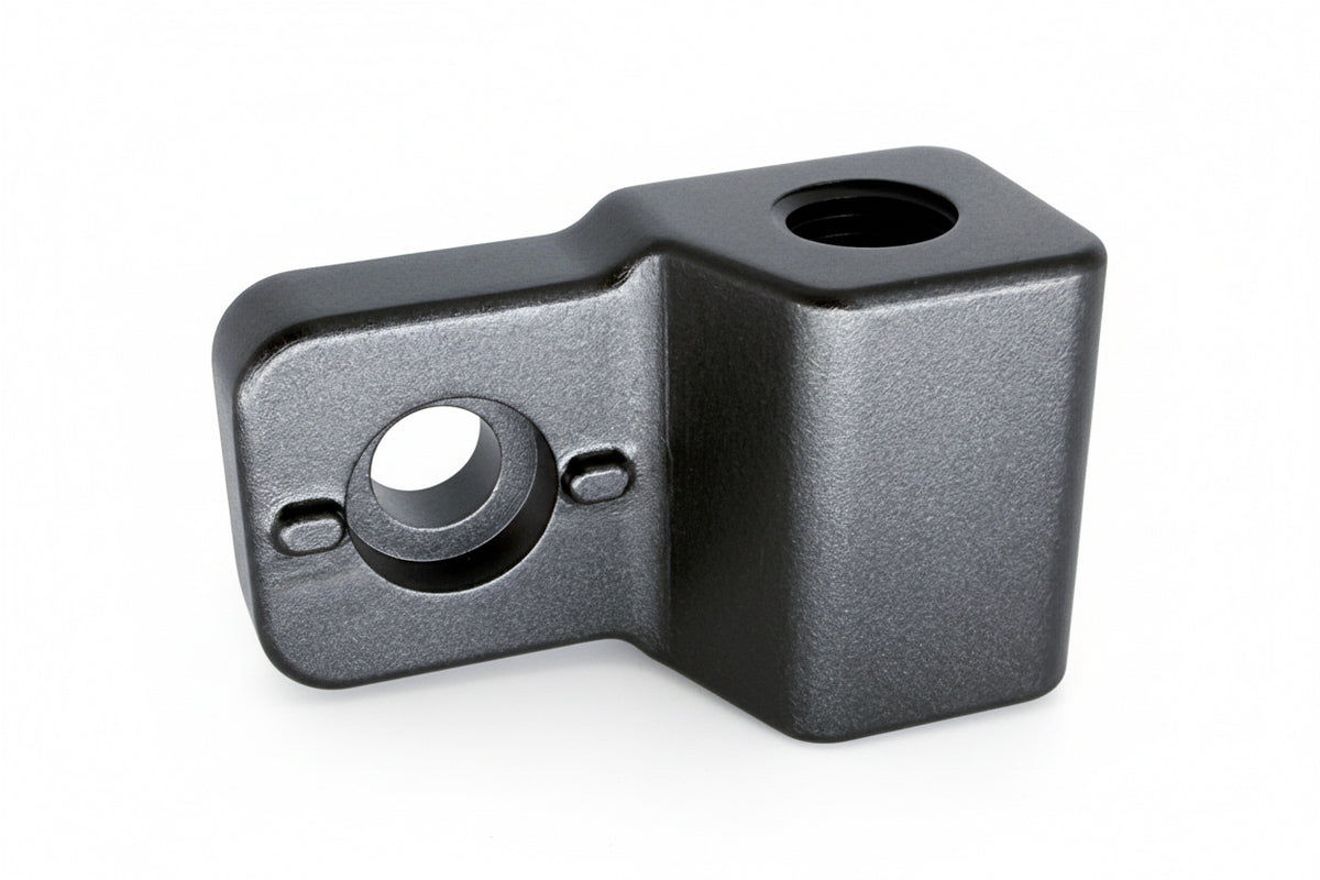 Metal bracket with two circular holes on a white background