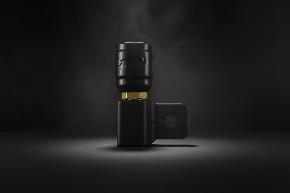 Black valve stem with gold accents on a dark background