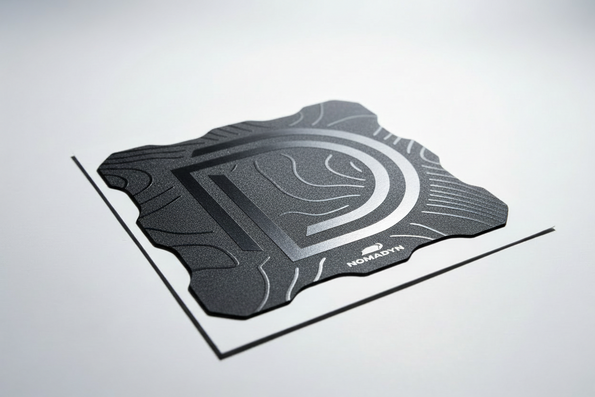 Black textured light cover with a logo on a light gray background