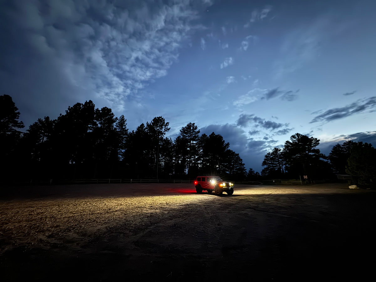 Angled view of Jeep at night, with side lighting showing range and light spread using flood lenses.