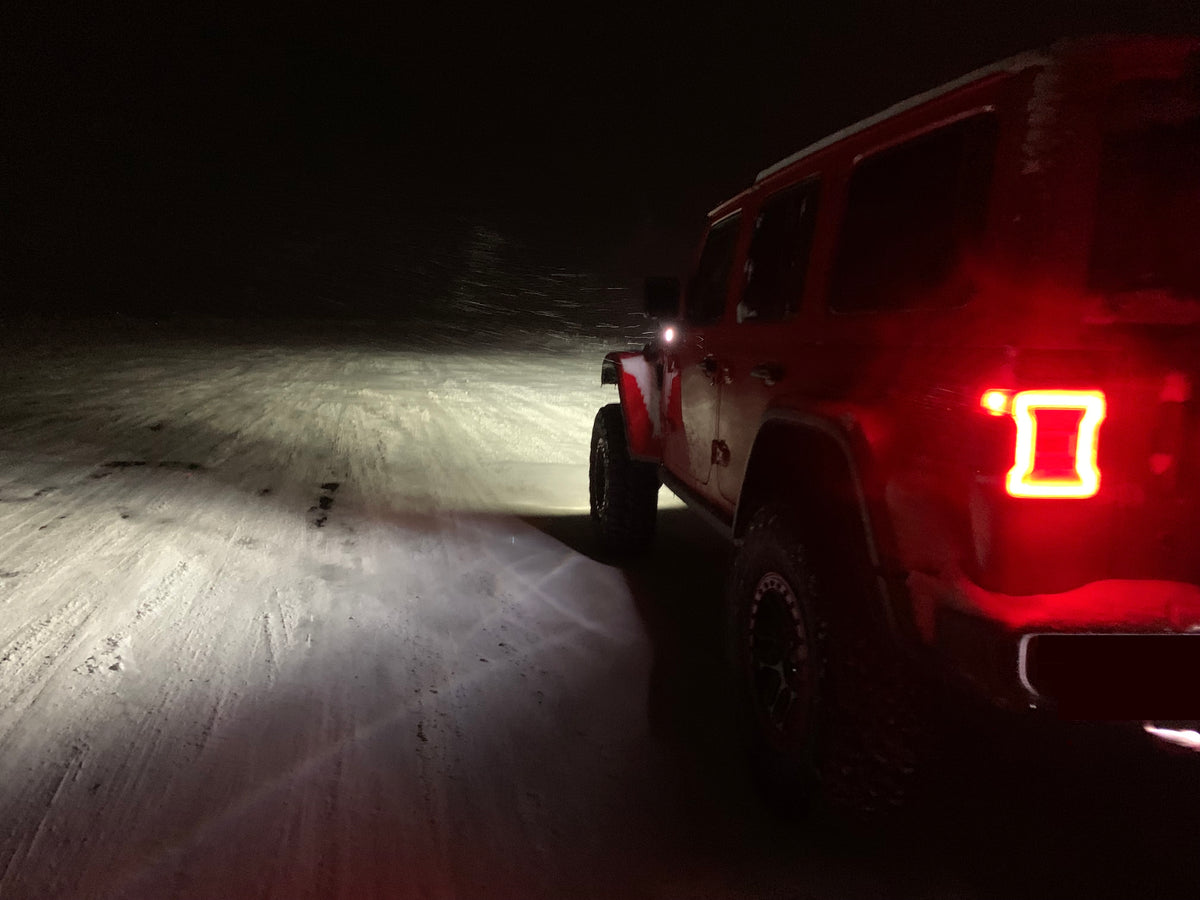 Insight Fusion Air testing at night, with light on and snow gently falling.  