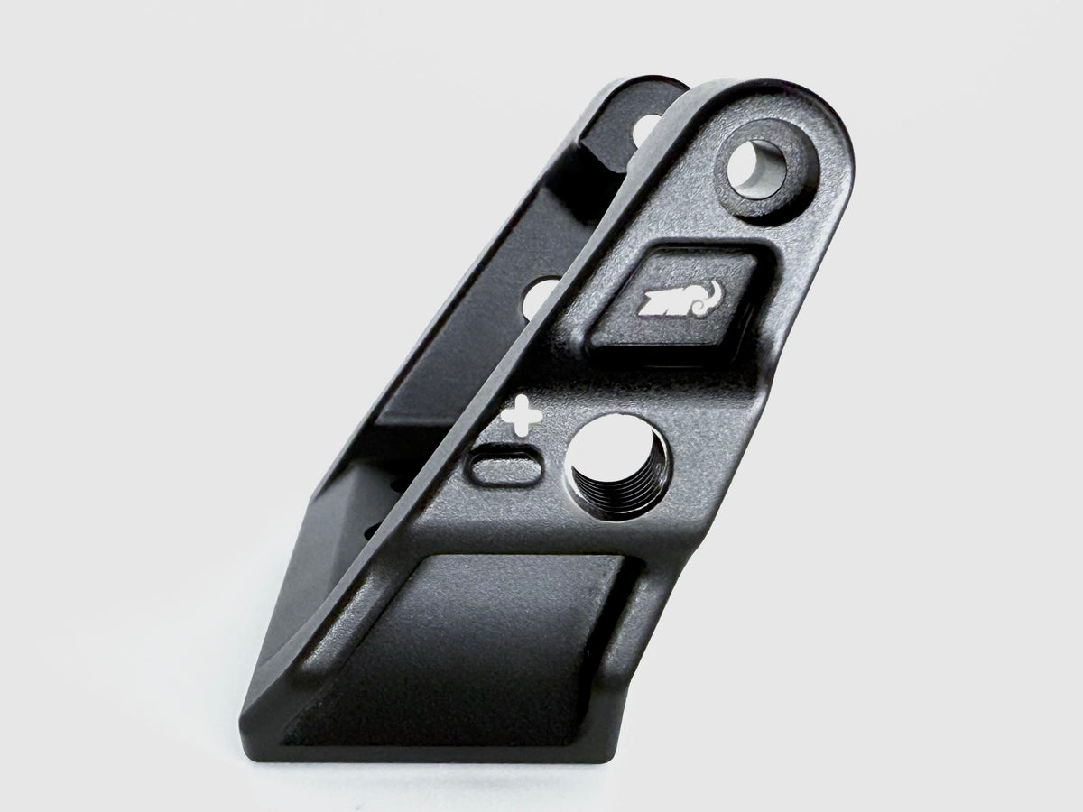 Black mechanical component on a light gray background