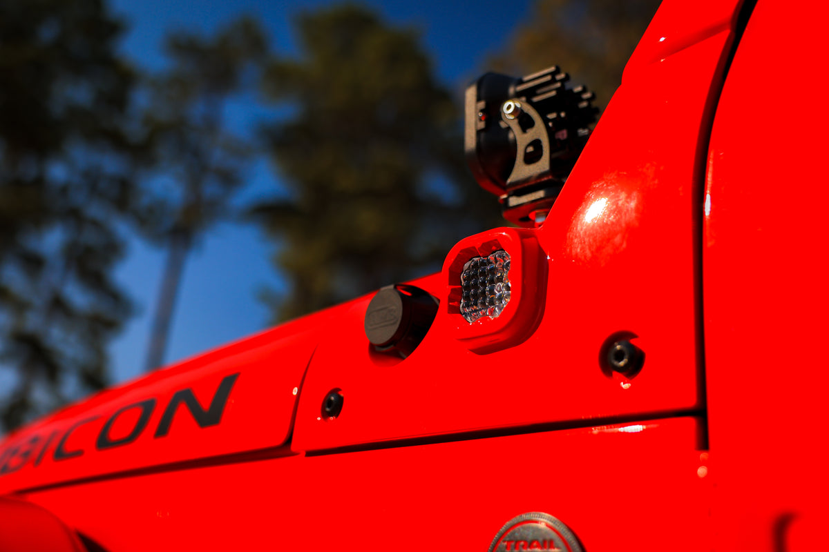 A Jeep equipped with Insight Fusion Air, shown from an upward angle.  The smooth, clean finish is highlighted with the setting sun shining against the surface.  