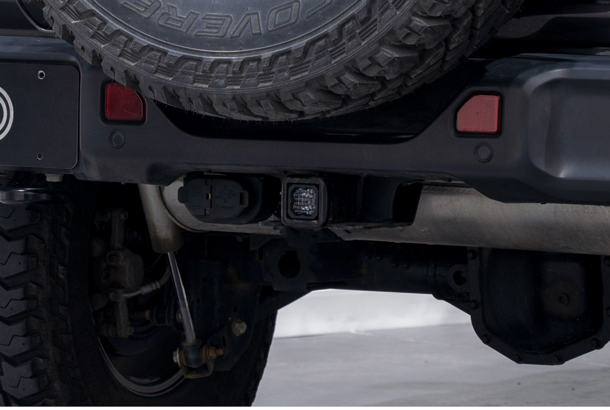 Diode Dynamics HitchMount Reverse Light Kit installed onto Jeep Wrangler rear bumper.