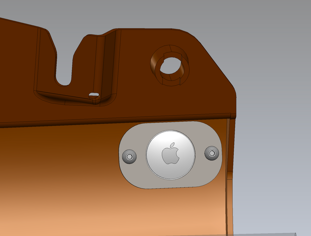 Mechanical component with a silver Apple logo badge on a gray background